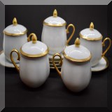P58. 11-Piece gold rimmed pots de creme set. Includes 5 mugs with lids and 6 saucers. - $33 